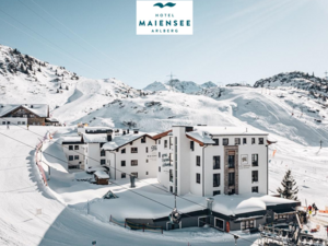 Zum Pressebereich des Hotel Maiensee Hotel Maiensee in schneebedeckter Berglandschaft in Arlberg