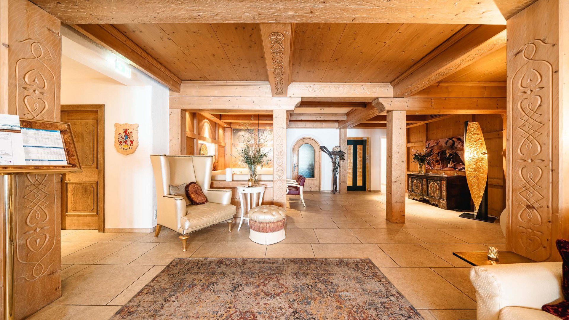 Holidays at the Arlberg: your hosts Cozy lobby area with wooden ceiling and comfortable armchairs